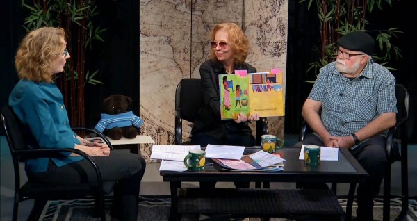 discussing a page from my picture book Smelling Sunshine with Darlene and Doug Carman on their cable access TV show; Darlene Carman